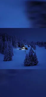 Snowy cabin under a midnight blue sky with illuminated windows.