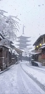 Snow-covered Japanese street with pagoda.