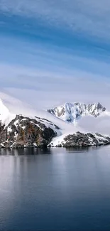 Mobile wallpaper of snow-covered mountains and tranquil water.