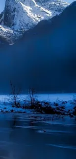 Snowy mountain landscape with blue hues.