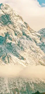 Serene snowy mountain against blue sky.