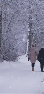 Winter path through snowy forest with two people walking.