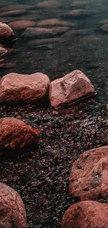 Stone riverbank with tranquil water and rocks in earthy tones.