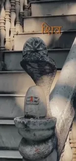 Stone stairs with a snake idol in tranquil setting.