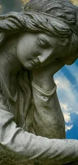 Stone statue against vibrant sky background.