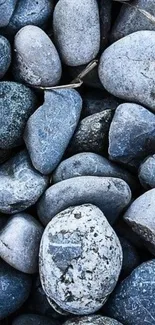 Blue-toned stone texture wallpaper with smooth pebbles for a calming effect.