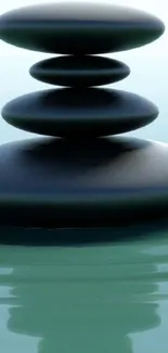 Calming zen stones balanced on tranquil water.