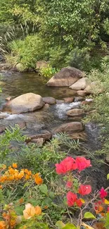 Serene stream with colorful flowers and greenery.