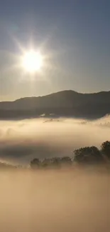 Sunlit misty mountain landscape with a radiant sunrise and serene atmosphere.