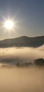 Bright sunrise over misty mountains and foggy valleys for mobile wallpaper.