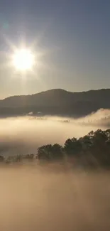 Serene sunrise over misty mountains, perfect for wallpaper.