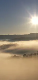 Calm sunrise over misty hills wallpaper.