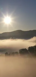 Sunrise over misty hills with fog enveloping the landscape.