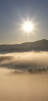 Sunrise over misty hills with golden light cast.