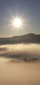 Serene sunrise over misty mountains creating a tranquil scene.