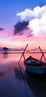 Peaceful boat at sunrise on calm reflective waters with vibrant purple sky.