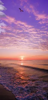 Purple sunset over tranquil ocean waves with a golden horizon.