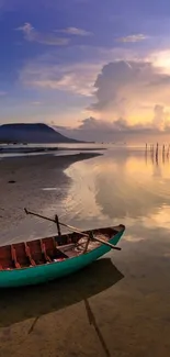 Wooden boat on serene sunset beach with golden reflections.