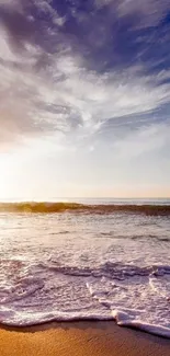 Serene beach at sunset with waves and vibrant sky.