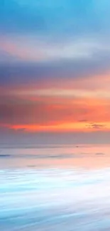 Serene sunset beach scene with vibrant sky.