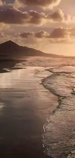 A tranquil sunset beach scene with waves and mountains.