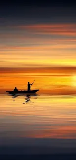 Fishermen silhouetted against a fiery sunset on tranquil waters.