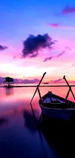 Tranquil boat at sunset on a calm lake with vibrant skies. Perfect for any device.