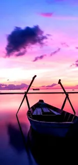 Serene sunset mobile wallpaper with a boat on calm waters.