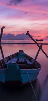 Mobile wallpaper of a boat on calm sunset waters with purple sky.