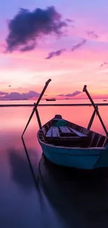 A serene sunset with a boat on calm waters under a pink and purple sky.