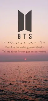 BTS logo sunset wallpaper with ocean and lyrics on mobile screen.