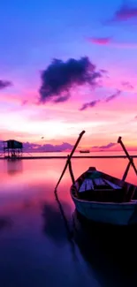 A tranquil sunset over a calm lake with a boat in the foreground.