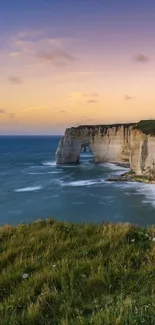 Serene sunset over ocean cliffs wallpaper.