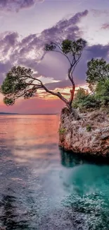 Serene sunset over a rocky coastal landscape with vibrant colors.