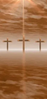 Three crosses at sunset with a serene copper background.