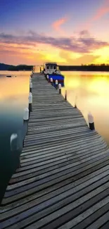 A serene dock extending over a lake at sunset with vibrant orange hues.