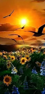 Stunning sunset with flying birds over a field of wildflowers.