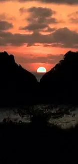 Sunset view with island silhouette over ocean, capturing evening tranquility.