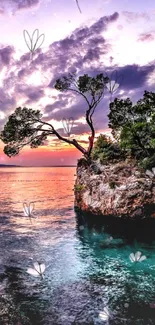 Sunset over a rocky island with tranquil waters and lush greenery.