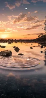 Serene sunset over lake with reflection.