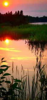 Serene sunset over a tranquil lake with vivid reflections and lush greenery.