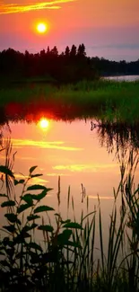 Serene sunset over a calm lake with vibrant reflections.