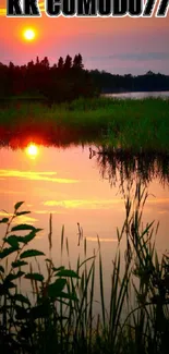 Peaceful sunset reflecting on a tranquil lake with lush greenery.