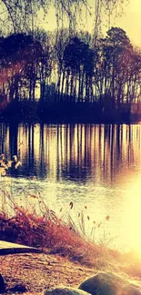 Tranquil sunset at lake with trees reflecting in water.