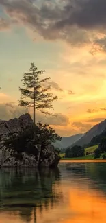 Sunset over serene lake with mountain backdrop.