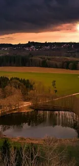 Serene sunset landscape with a calm reflecting pond.