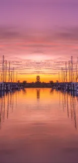 Mobile wallpaper featuring a sunset marina with vibrant purple reflections.