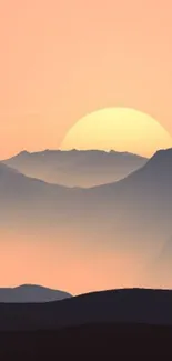 Serene sunset over mountains with soft pastel tones.