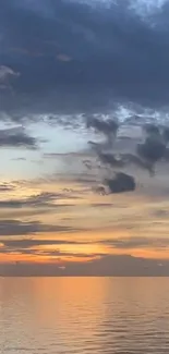 Ocean view at sunset with dramatic clouds and calming hues.