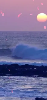 Serene sunset over ocean with pink petals and waves.